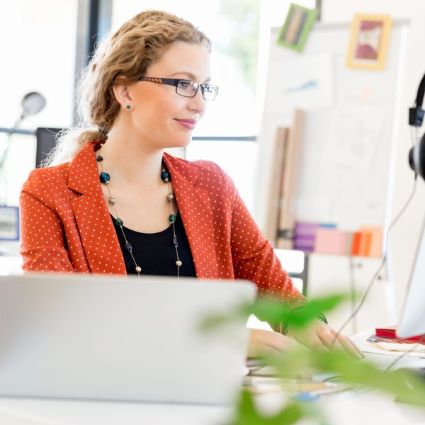 Young woman in casual clothes in an office